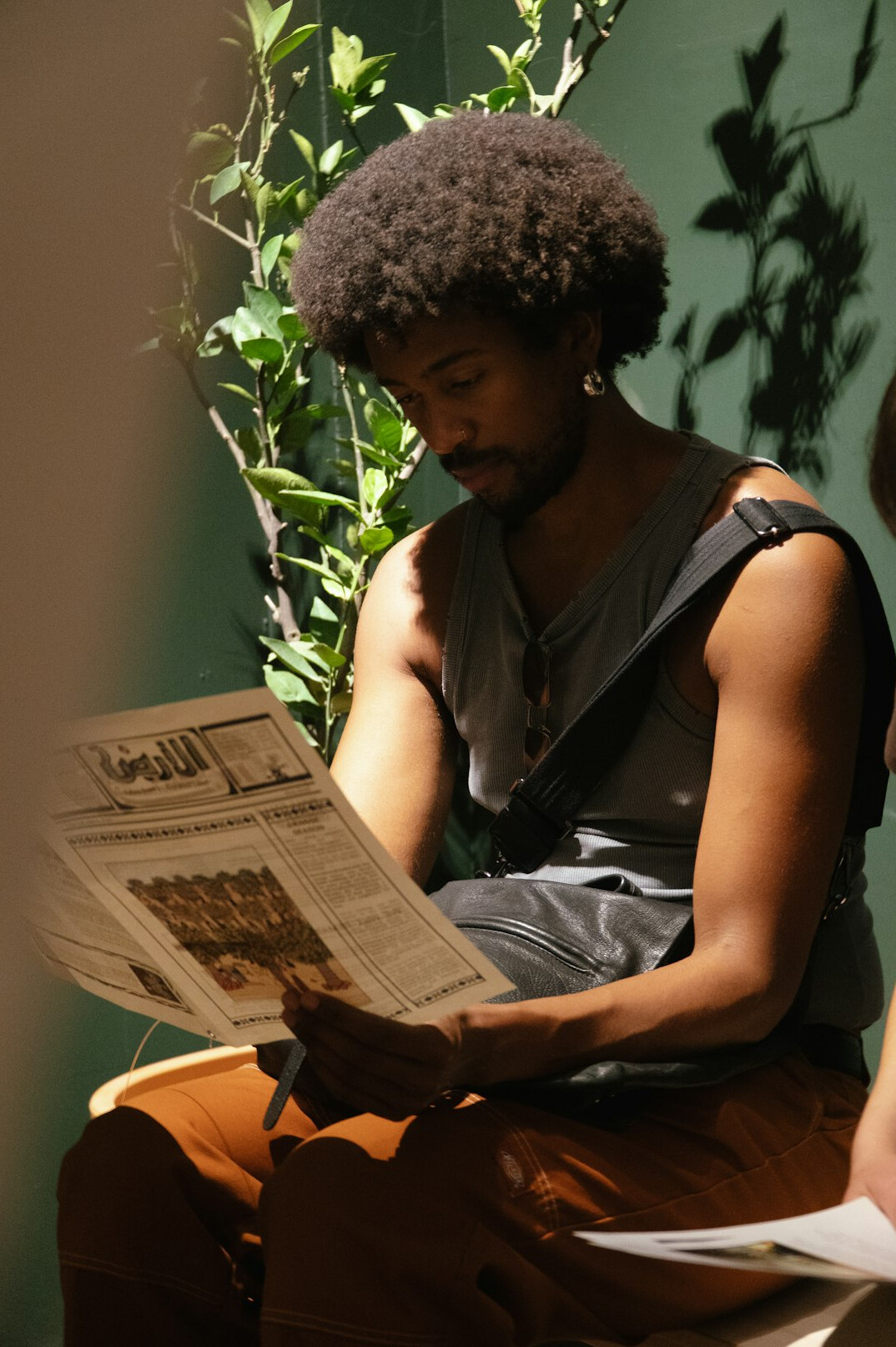 young person reading magazine
