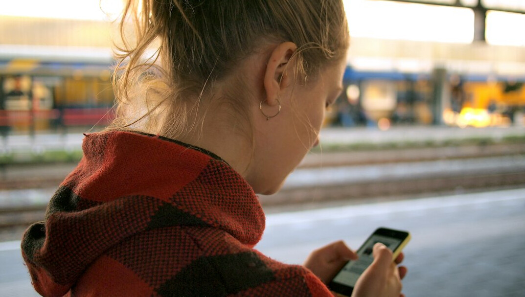teenager scrolling phone